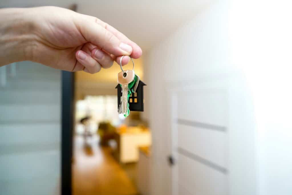 Buyer receiving the keys to a new home before completing the home buying process in Middle Georgia.
