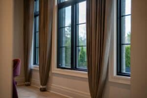 Luxury home interior with large windows and custom drapery representing quality in Macon GA real estate