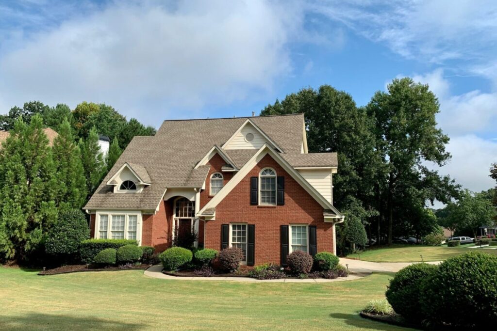 Brick home representing the local housing market for buyers and sellers in 2026