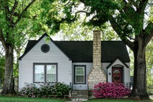 Well-maintained Macon home prepared for sale with mature trees and flowering landscaping