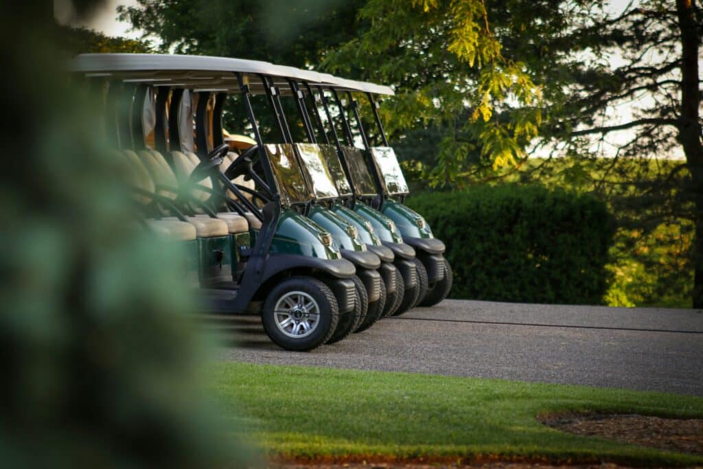 Golf carts lined up at a country club golf course in Macon, Georgia