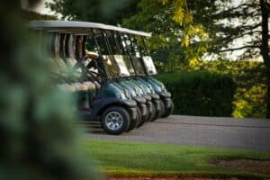 Golf carts lined up at a country club golf course in Macon, Georgia